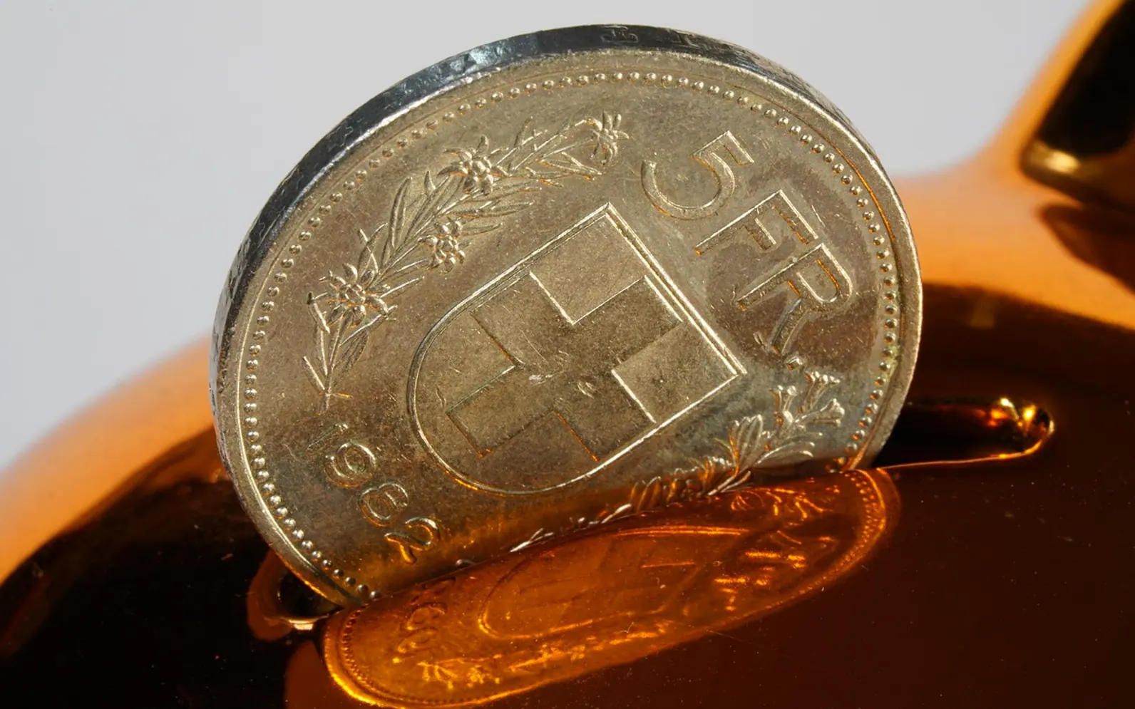 Five swiss francs, swiss francs and coin