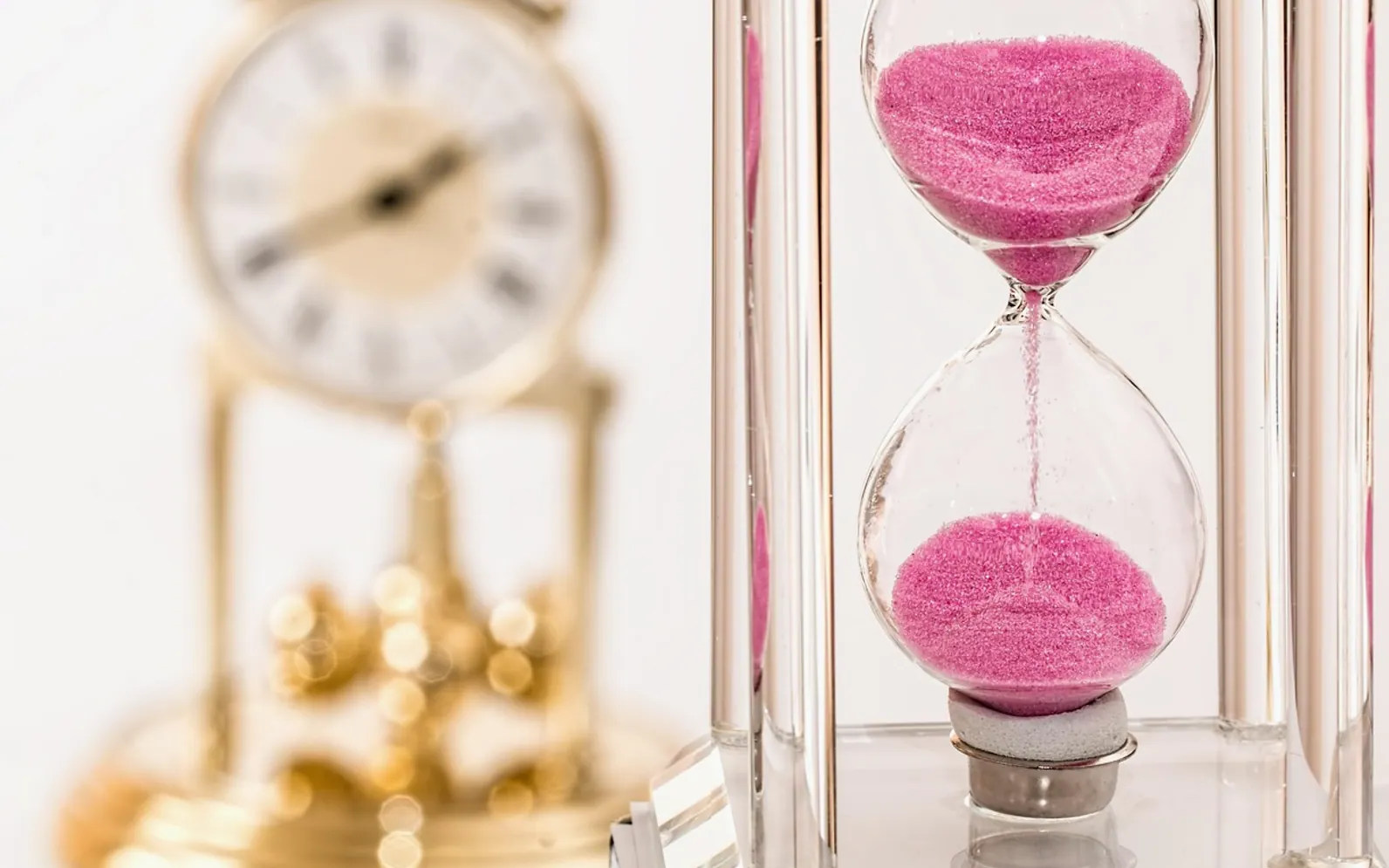 Hourglass, clock and time